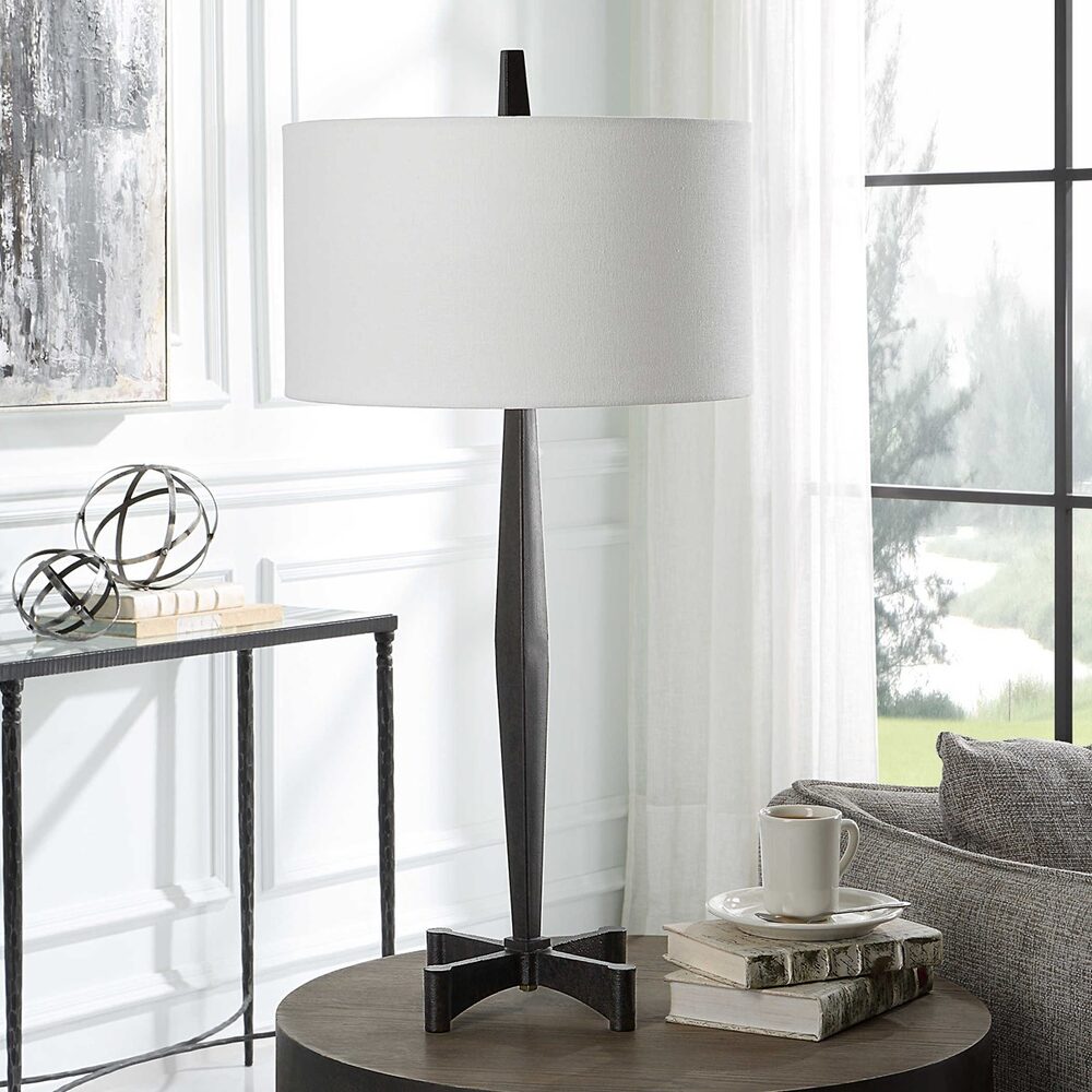 Industrial-inspired Katana Table Lamp with a sleek black finish and unique tapered shape.