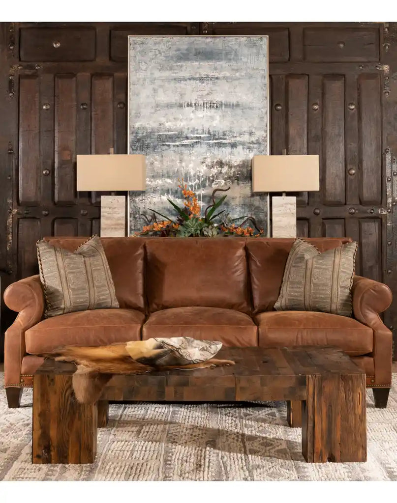 The Ivanna Coffee Table styled in a rustic living room, paired with leather furniture and natural decor elements for a cohesive look.