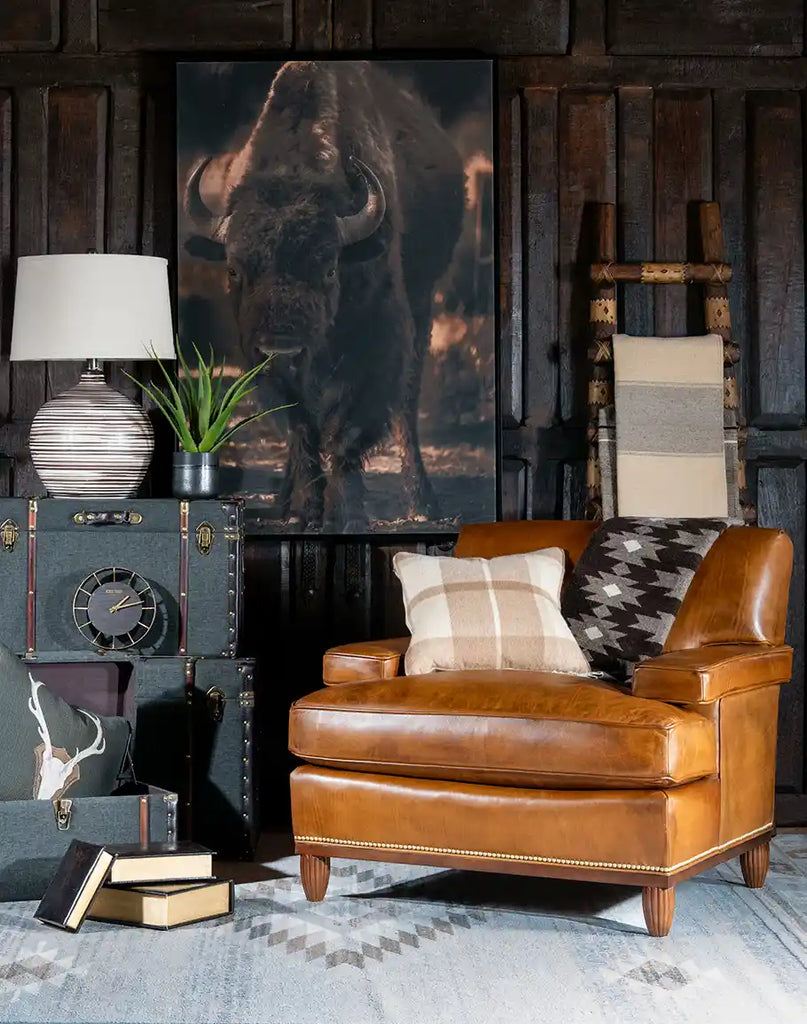 The Jaxon Leather Chair displayed in a rustic cabin setting, complementing Western-themed décor.