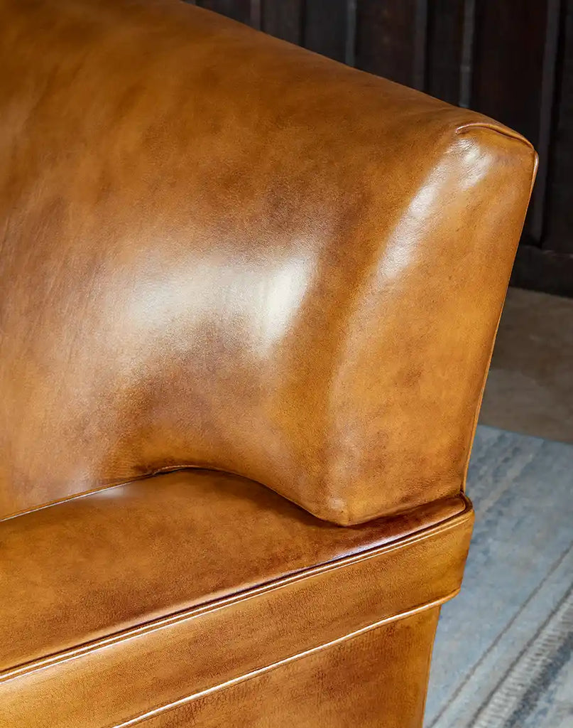 Close-up of the hand-burnished leather on the Jaxon Leather Sofa highlighting the artisanal craftsmanship.