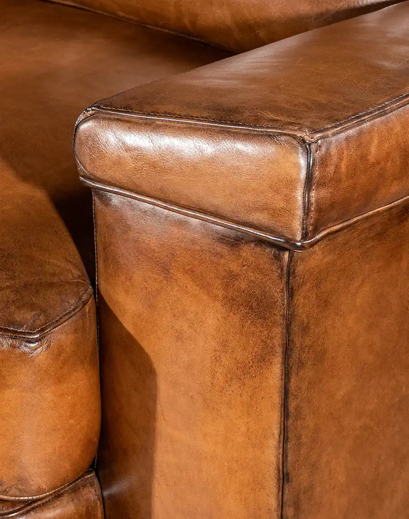 Image focusing on the armrest structure, showcasing support and design details of the Jefferson Leather Sofa.