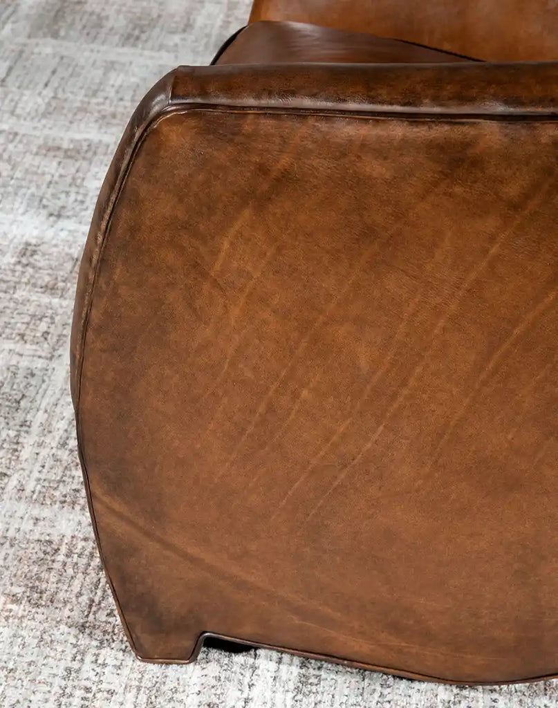 Detailed view of the armrest on the Johnson Leather Chair, featuring artisanal leatherwork and a sleek, refined design.