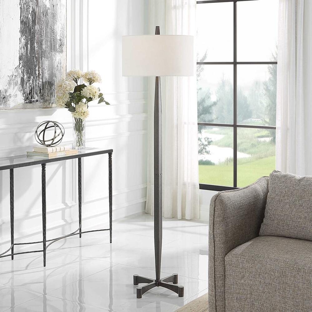 Katana Floor Lamp with an aged black tapered base, rust distressing, and a white linen drum shade.