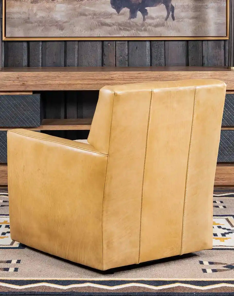 Rear perspective highlighting the light sandy brown shearling on the seat cushion and the chair's overall craftsmanship.