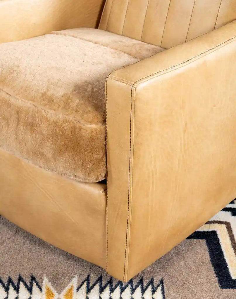 Detailed image focusing on the rich texture of the hand-burnished full-grain Palomino leather upholstery.