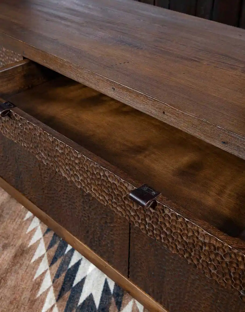 A drawer of the La Flor Dominicana Buffet shown open, featuring thick saddle leather pulls and ample storage space for household essentials.