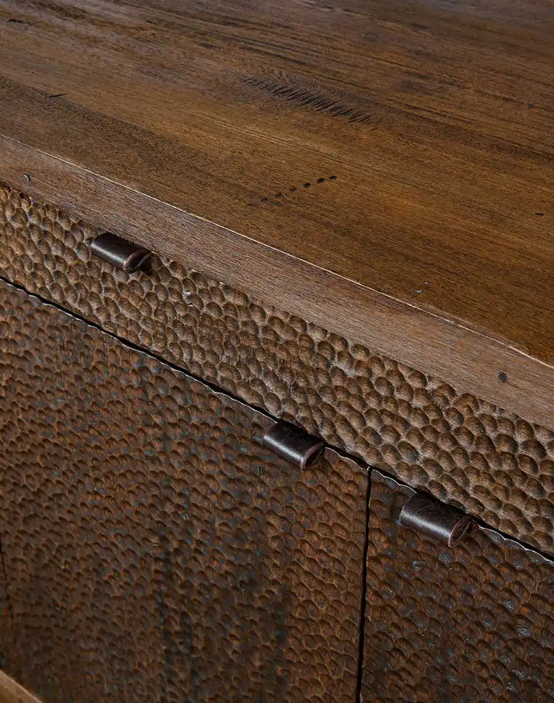 A closer look at the buffet's surface, showcasing the combination of rustic hand-distressed finish and refined craftsmanship.