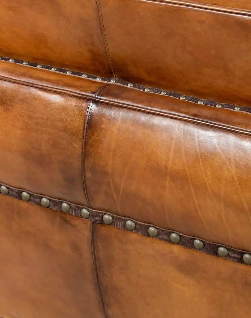 Close-up of the exquisite leather gimp detailing along the sides of the Herdsman Western Leather Sofa.