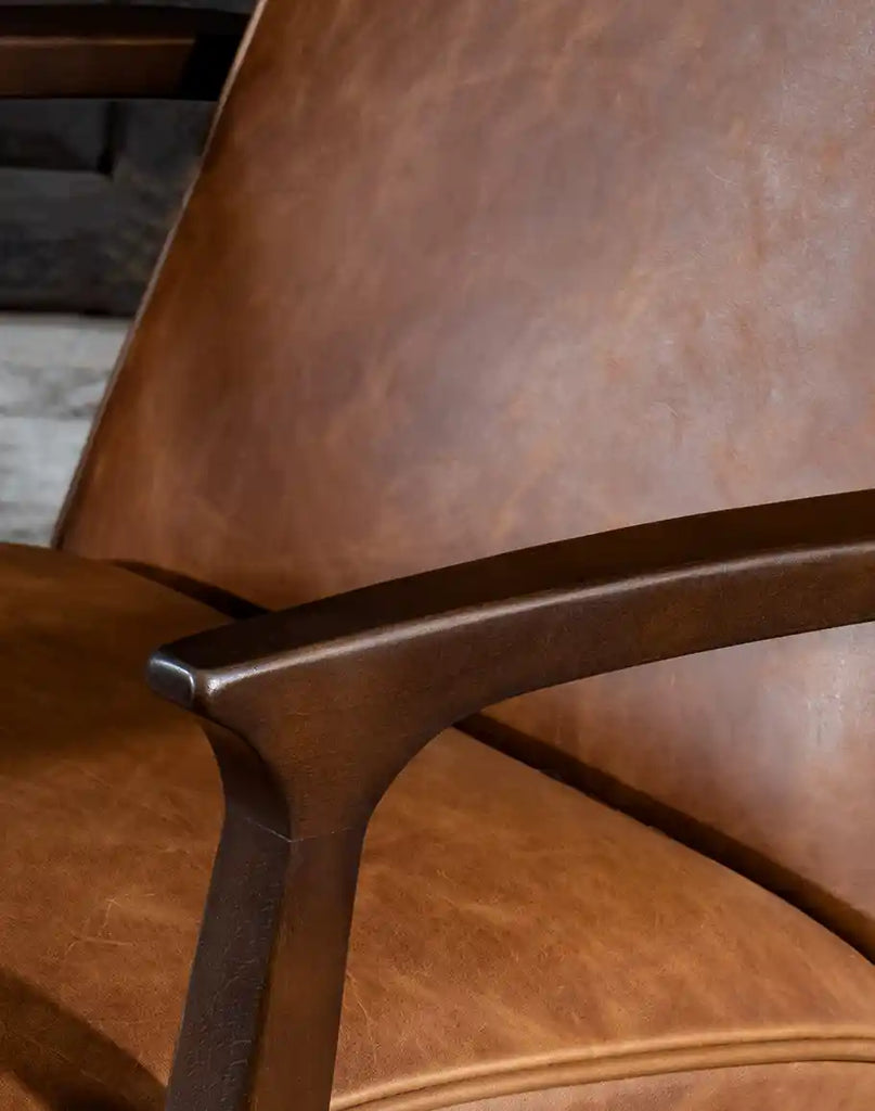 Close-up of the tapered wood armrests on the Liyanna Leather Recliner, highlighting its modern rustic craftsmanship.