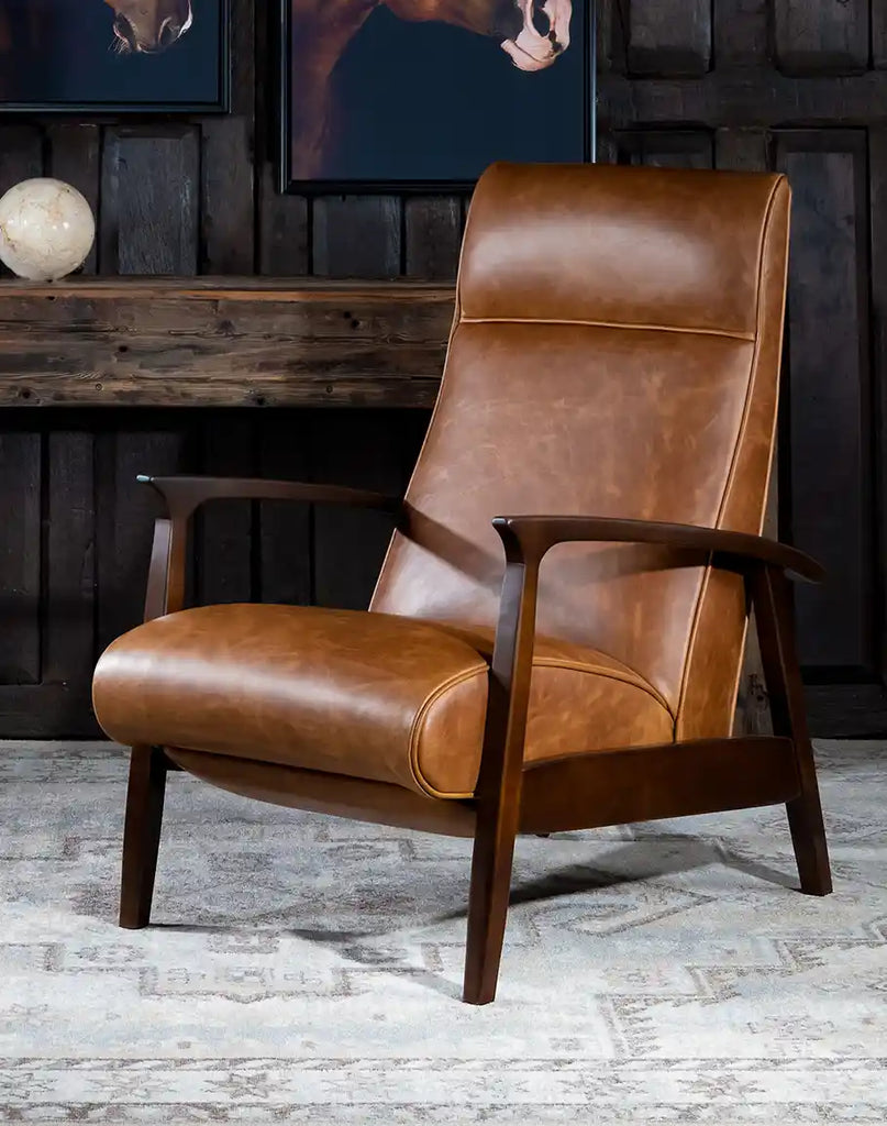 Liyanna Leather Recliner showcasing its sleek silhouette, tapered wood arms, and premium leather upholstery.