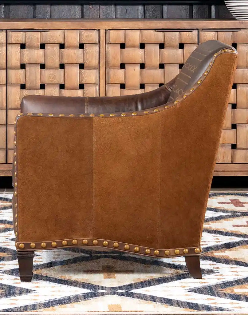 The luxurious Cassie Brown Leather Chair combines full-grain leather and craftsmanship for unmatched comfort and style.