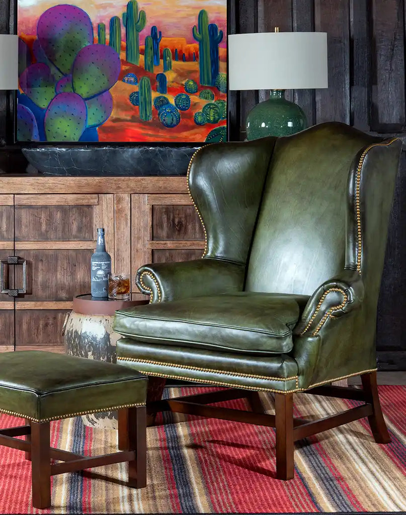 Matching ottoman with hand-brushed olive-green leather upholstery, complementing the Olive Green Wingback Chair.