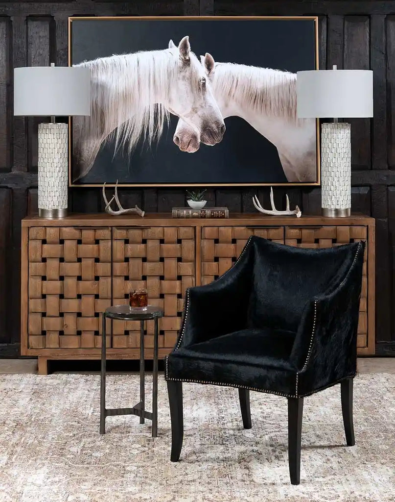 The McClaren Midnight Cowhide Chair styled in a rustic living room, complementing Western and ranch-inspired décor.