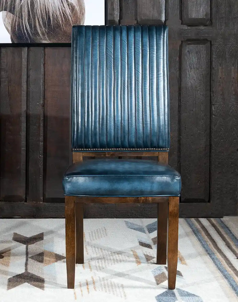 Front view of the Midnight Hue Dining Chair showcasing its blue top-grain leather upholstery and modern rustic frame.