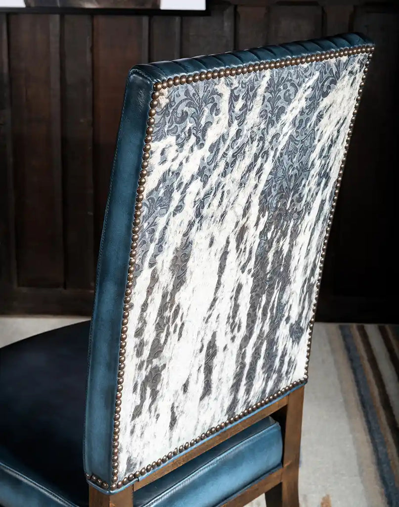 Close-up of the hair-on-hide back featuring a stemmed floral pattern, showcasing the chair's unique design element.