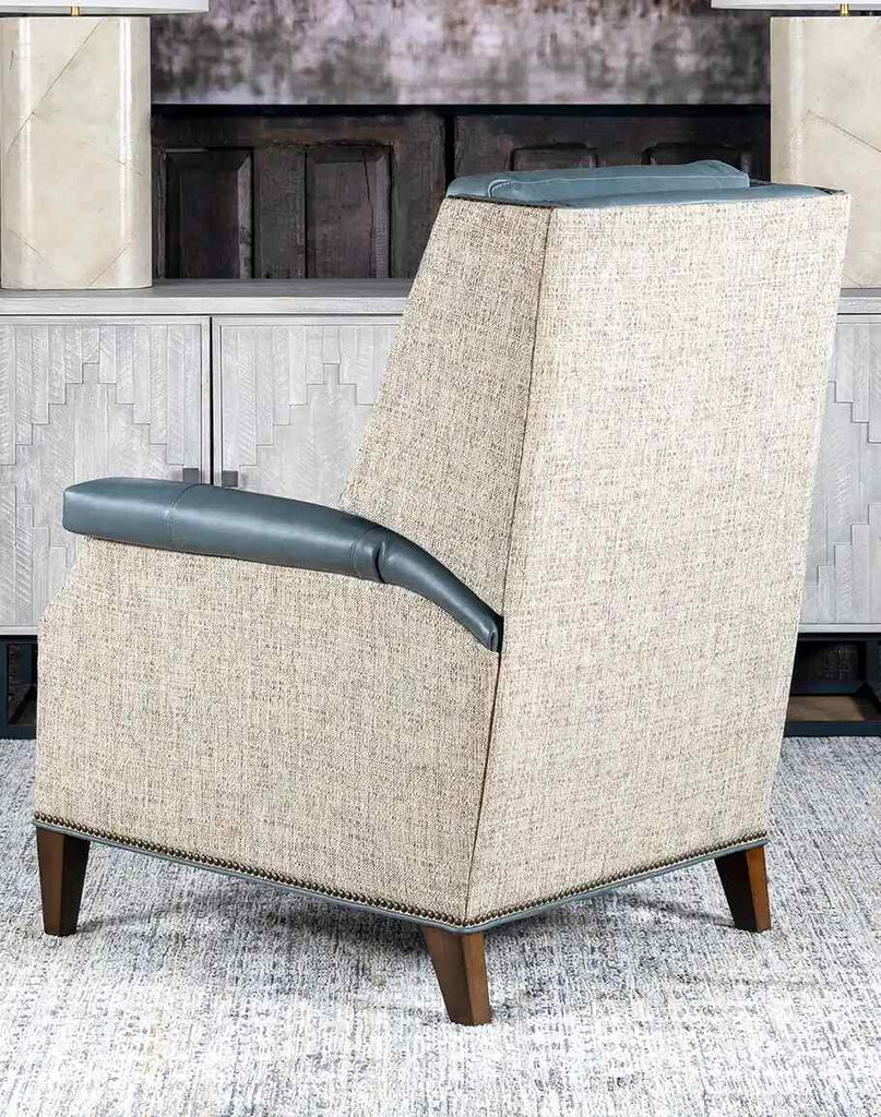 A rear view of the recliner, displaying the hand-burnished leather finish and detailed craftsmanship.