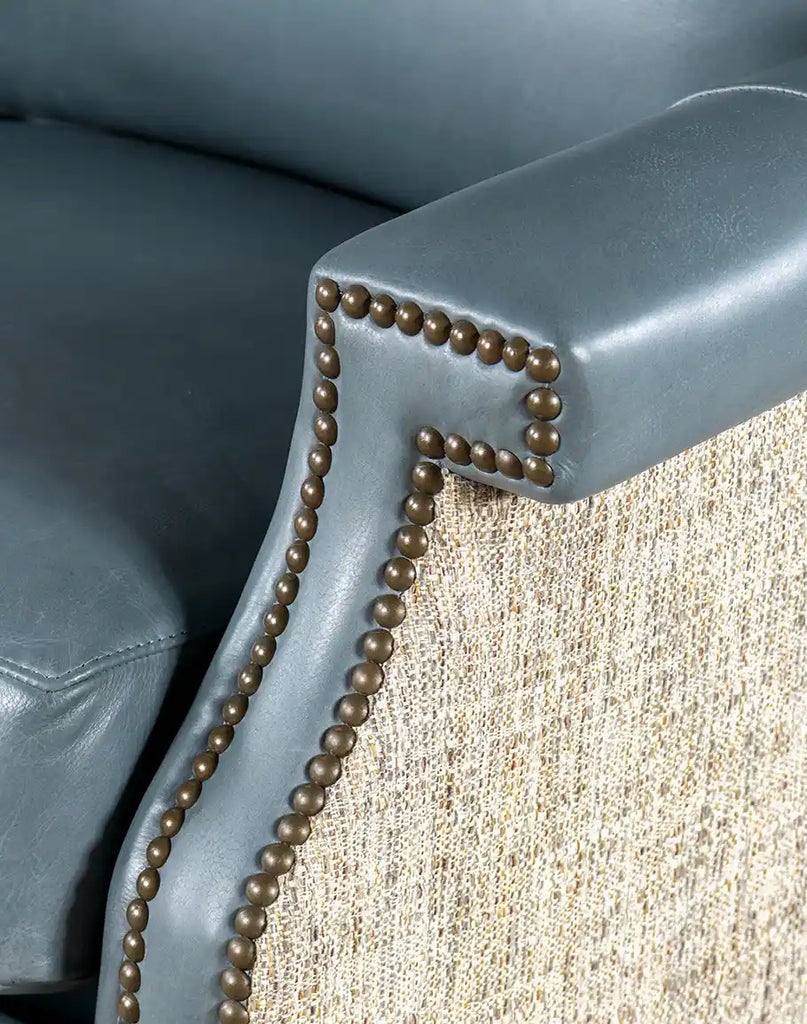 A detailed shot of the neutral-toned fabric on the armrests, enhancing the chair’s aesthetic and comfort.