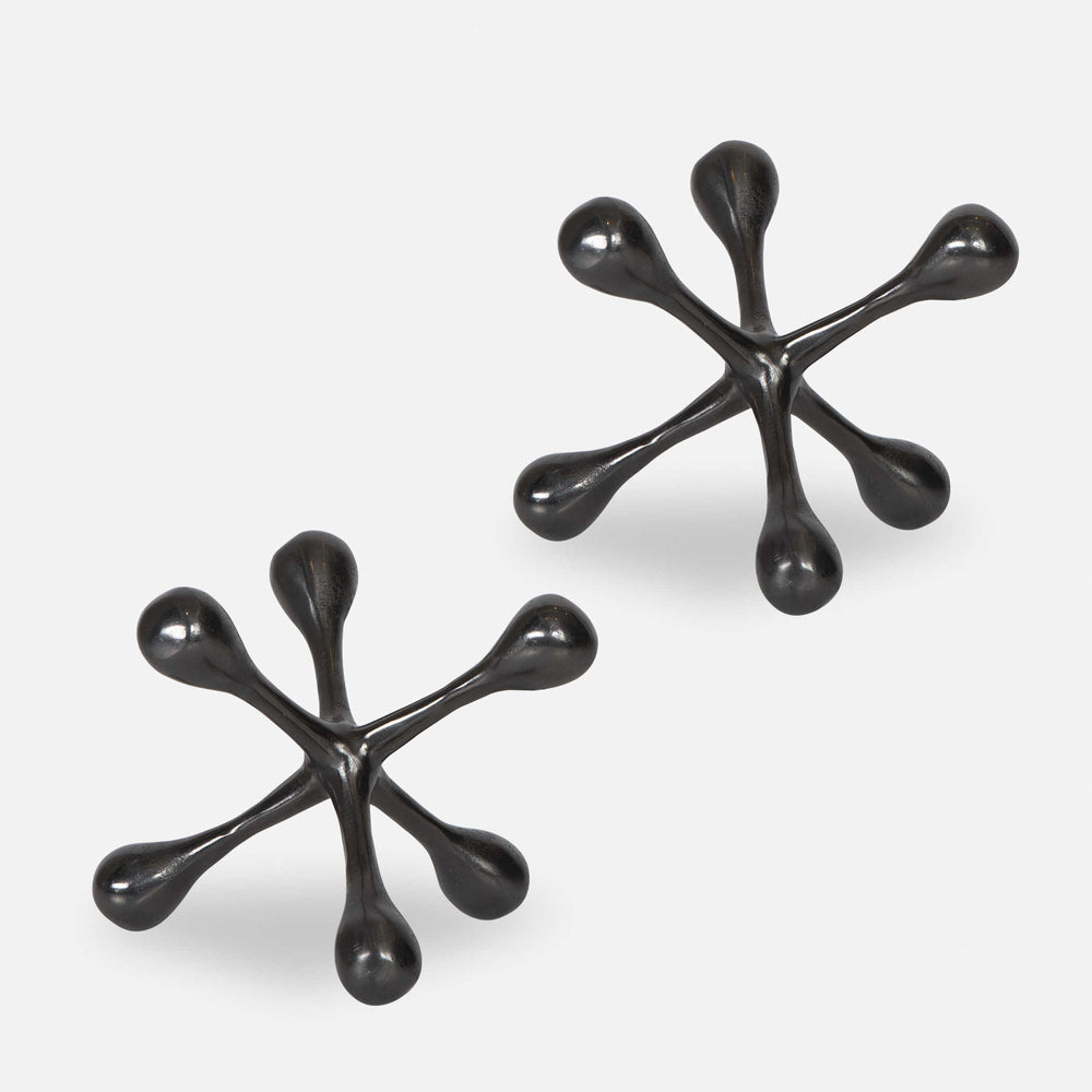 Modern black nickel decorative objects made from cast aluminum, perfect for any space.