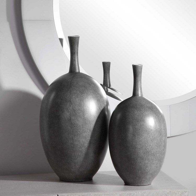 Stylish ceramic vases showcasing a bold black and white marbled pattern, perfect for adding a contemporary touch to any space.