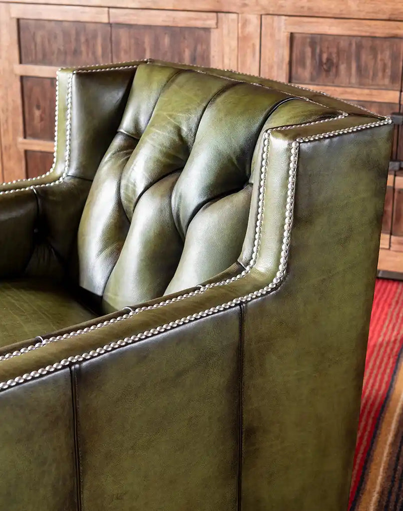 Detailed view of the deep button-tufted seat back, illustrating the meticulous upholstery work and design elegance.