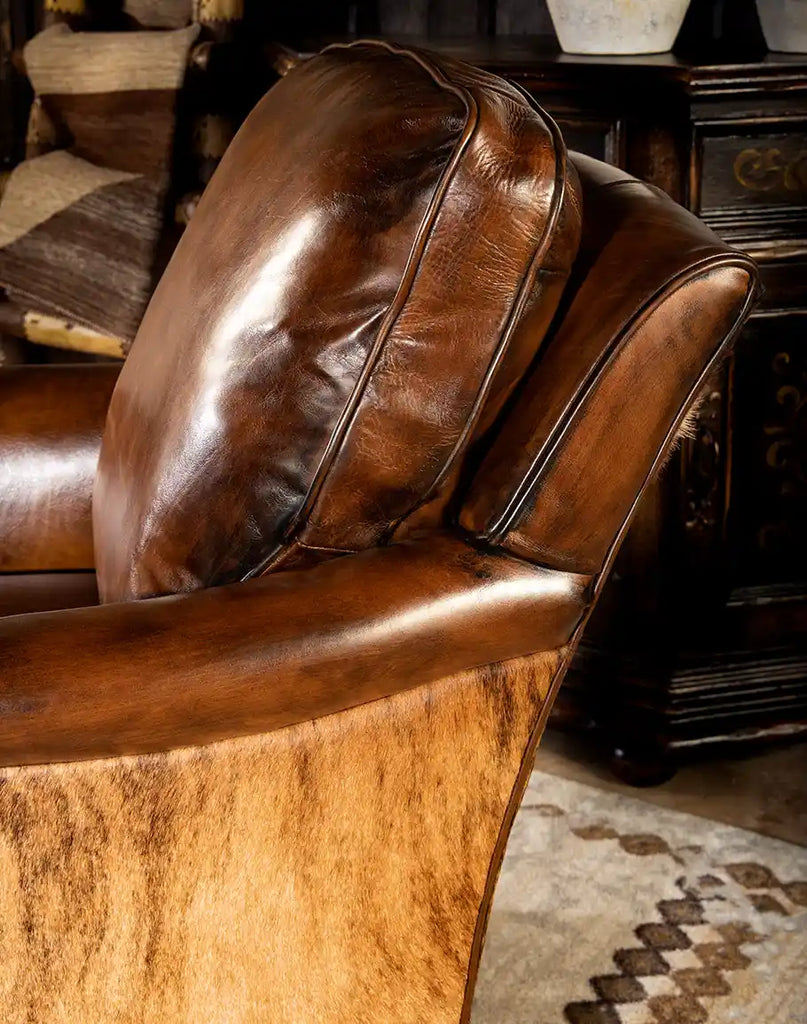 Close-up of the plush down seat and back cushions on the Mocha Leather Swivel Glider, designed for maximum comfort.