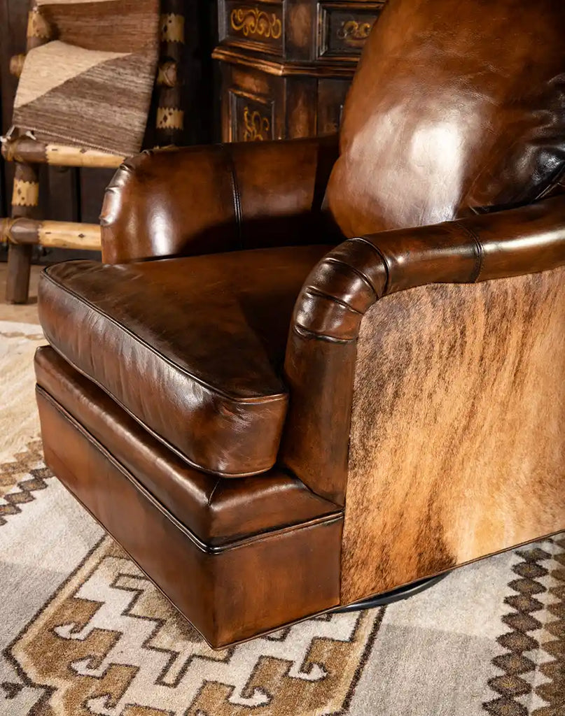 Close-up of the swivel base mechanism of the Mocha Leather Swivel Glider, ensuring smooth and effortless motion.