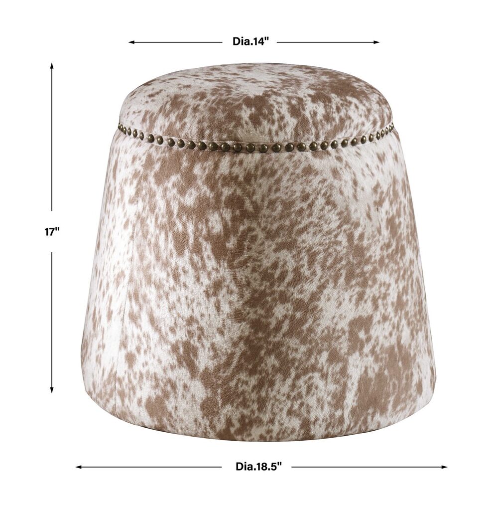 Decorative ottoman with soft faux cowhide in chestnut and white, highlighted by brass nailhead accents.