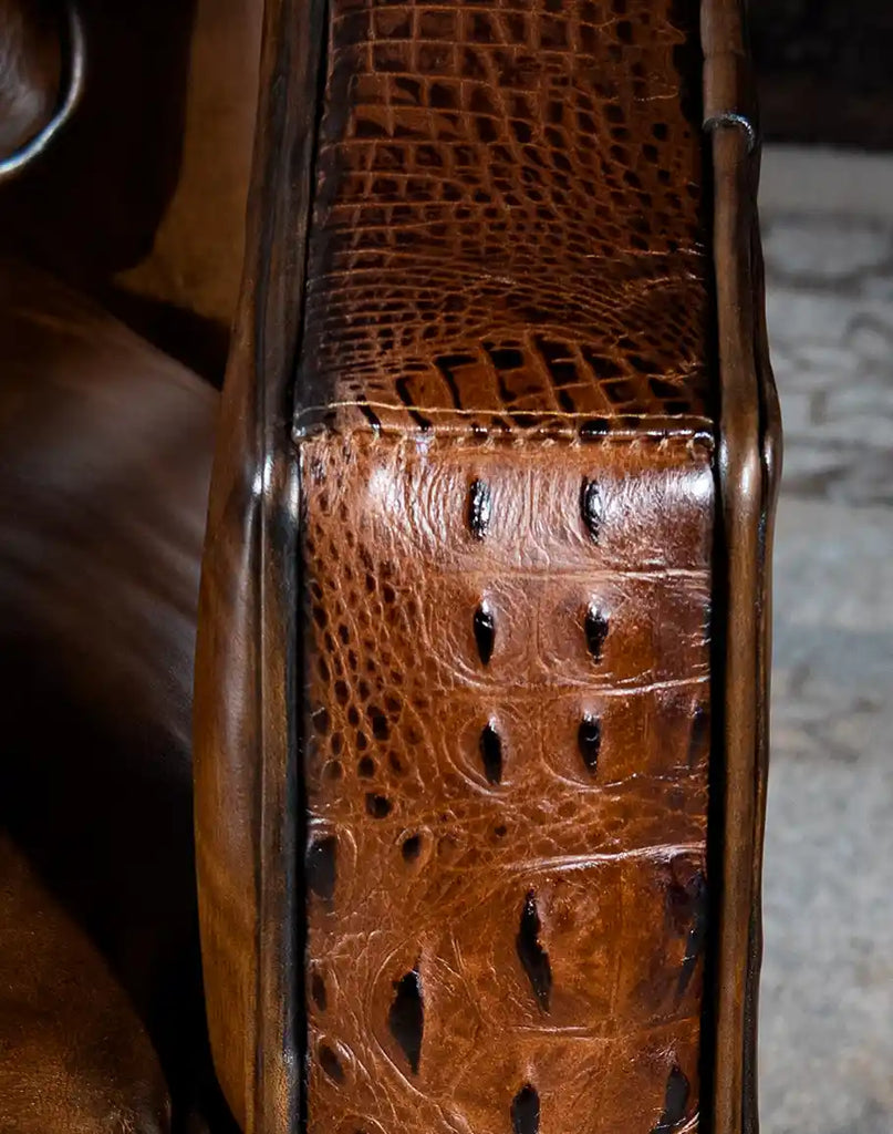 Close-up of the embossed croc leather accents on the Morocco Swivel Chair, showcasing its unique texture and luxurious finish.