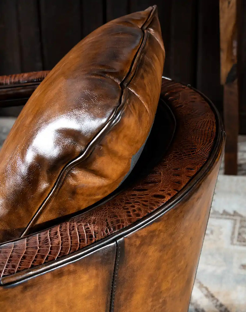 Detailed view of the hand-burnished leather on the Morocco Swivel Chair, revealing its rich tonal variations and artisanal quality.