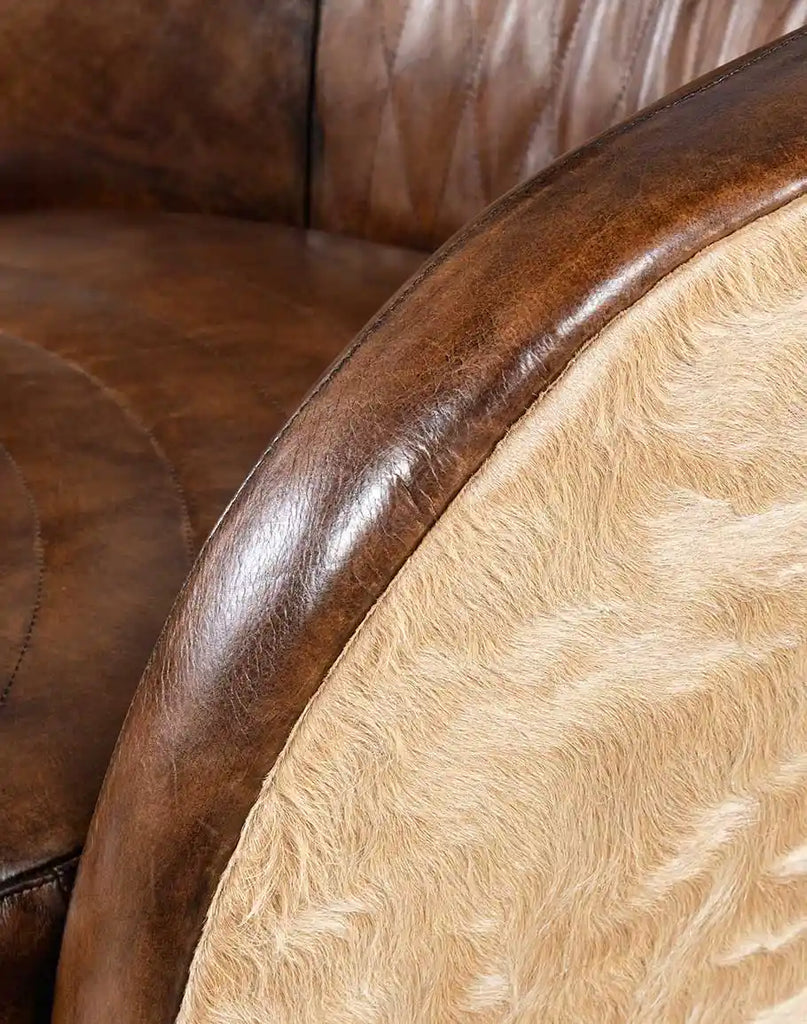 A close-up of the padded armrest on the Moscow Mocha Swivel Chair, offering both style and ergonomic support.