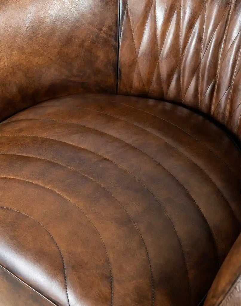 A close-up of the deep, plush seat cushion on the Moscow Mocha Swivel Chair, designed for ultimate comfort.