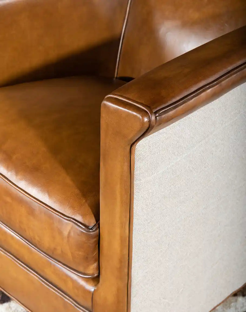 A detailed close-up of the full-grain leather on the Napoleon Club Chair, showcasing its natural texture, hand-burnished finish, and superior quality.