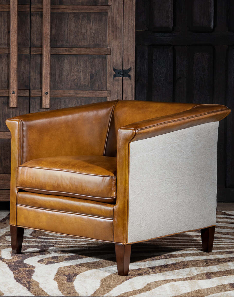 Napoleon Club Chair showcasing its luxurious full-grain leather upholstery, plush cushioning, and classic silhouette.