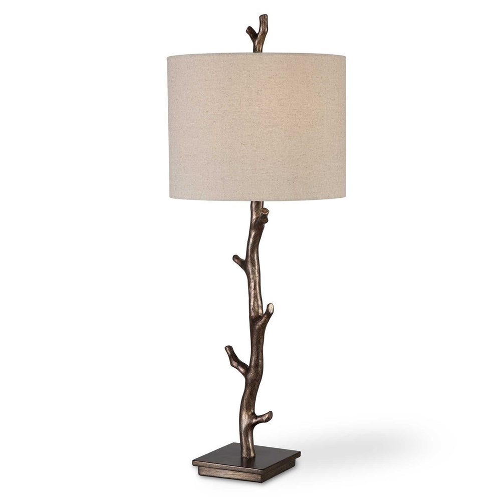 Natural-inspired table lamp featuring a branch-like dark bronze base and a slubbed oatmeal linen shade.