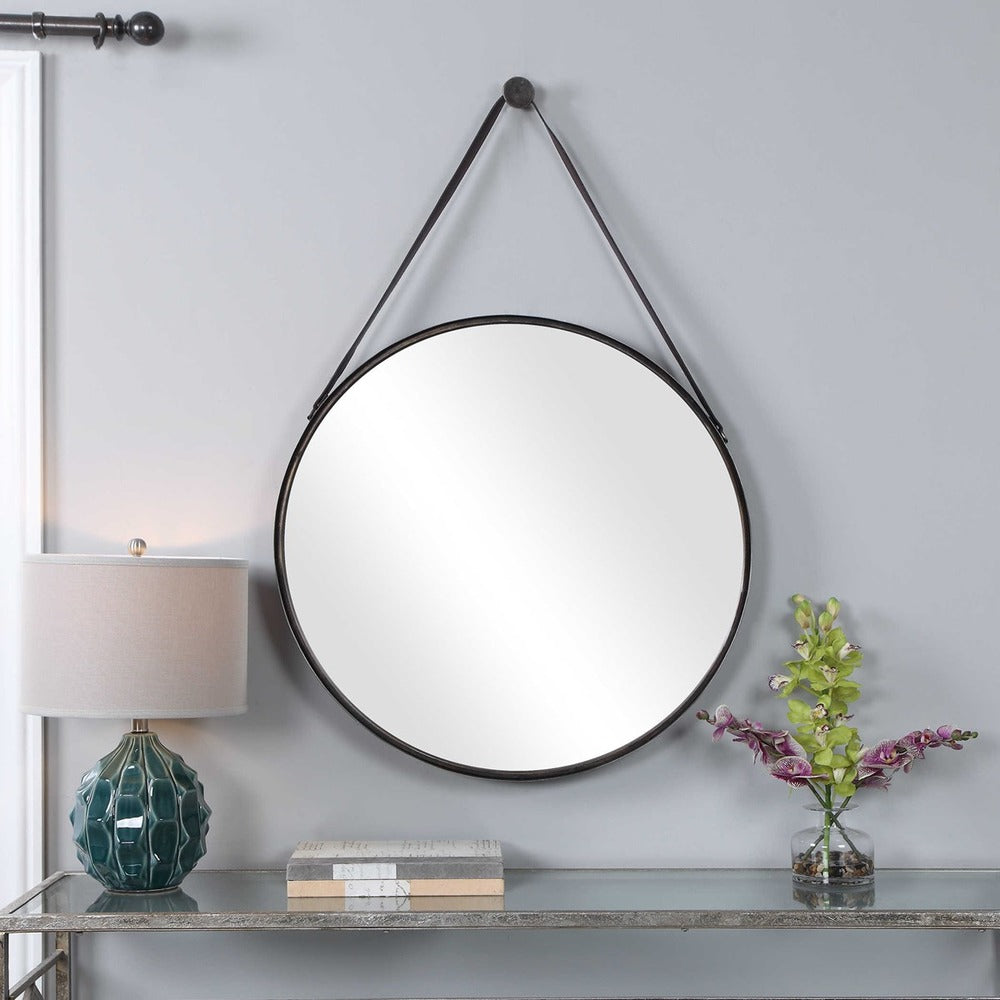 Charming round wall mirror with a Nordic design, antique bronze finish, and faux leather hanging details.