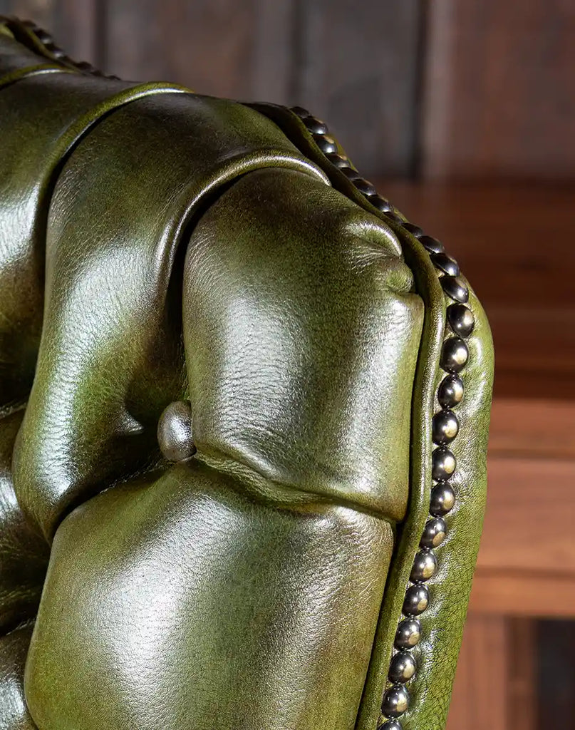 Close-up of the hand-burnished leather on the Norton Olive Executive Desk Chair, showcasing its luxurious texture.