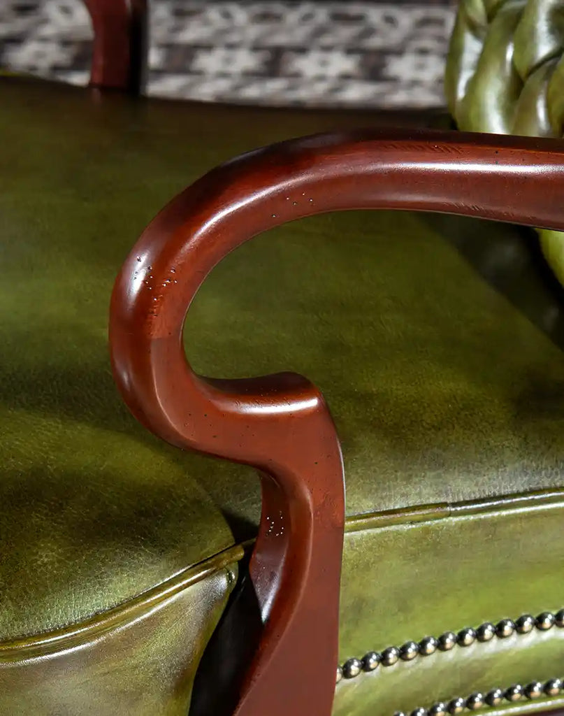 Detailed view of the hardwood armrests on the Norton Olive Executive Desk Chair, adding elegance and durability.