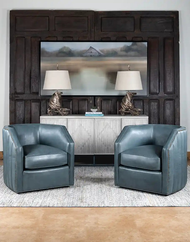 The Olga Grey Swivel Chair styled in a modern living room, demonstrating its versatility and sophisticated presence.