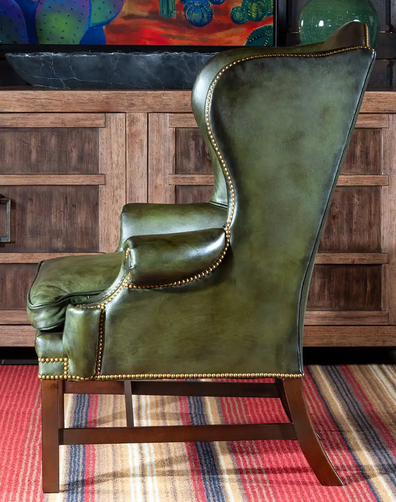 Side view of the Olive Green Wingback Chair showcasing its elegant silhouette and sturdy hardwood frame.