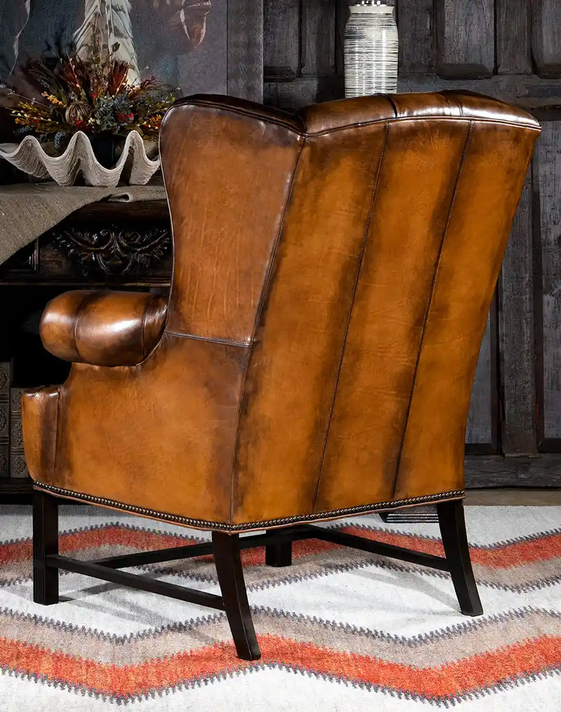 Back view of the Olivia Tufted Leather Chair displaying its smooth leather finish and wingback design.