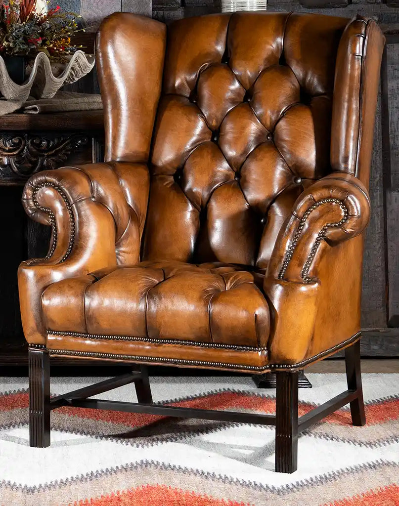 Olivia Tufted Leather Chair showcasing its hand-burnished leather upholstery and classic tufted design.