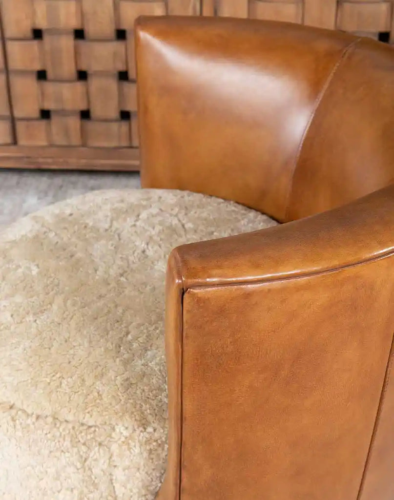 Angled perspective showcasing the chair's design, texture variations, and the harmony between shearling and leather.