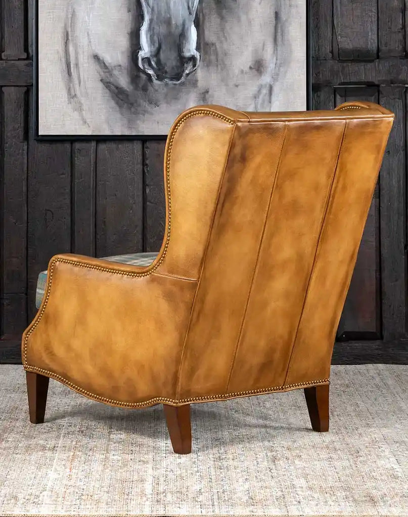 Back view of the Patterned Spruce Chair, showcasing its seamless leather upholstery and clean craftsmanship.