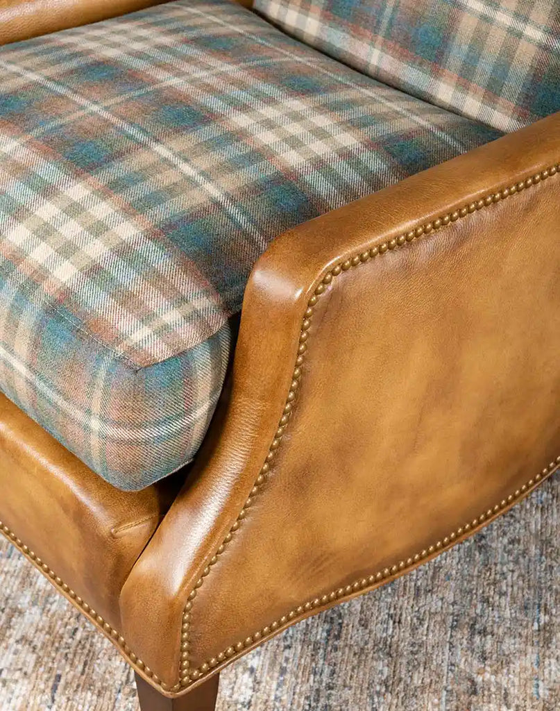 Close-up of the hand-burnished leather upholstery on the Patterned Spruce Chair, emphasizing its rich texture and craftsmanship.