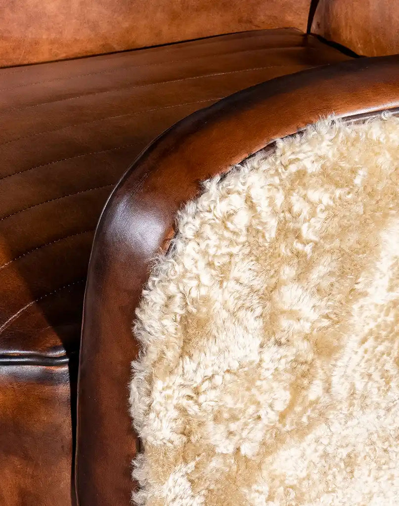 Focused shot of the plush shearling applied to the chair’s outer arms and back, showcasing its soft texture.