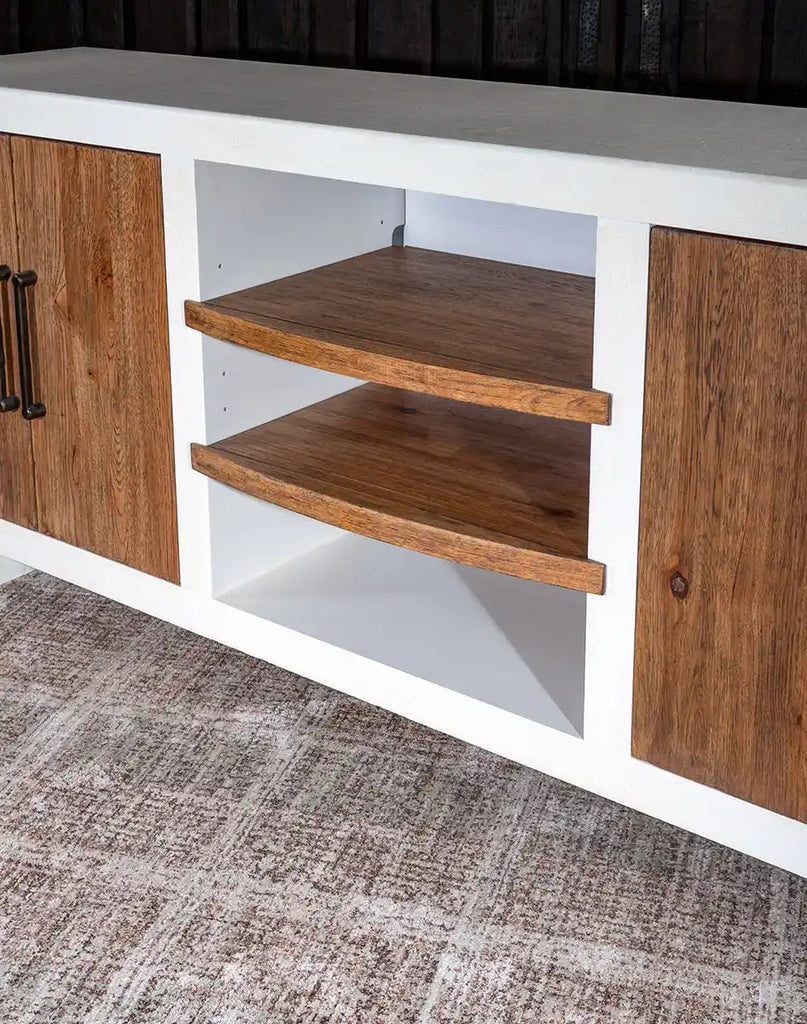 A close-up of the adjustable center section shelves in the Plano TX Media Console, designed for flexible storage options.