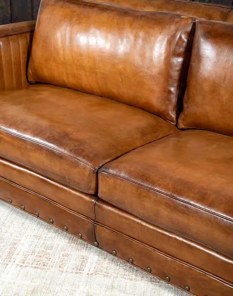 Image displaying the plush seat cushioning offering exceptional comfort on the Herdsman Leather Sofa.