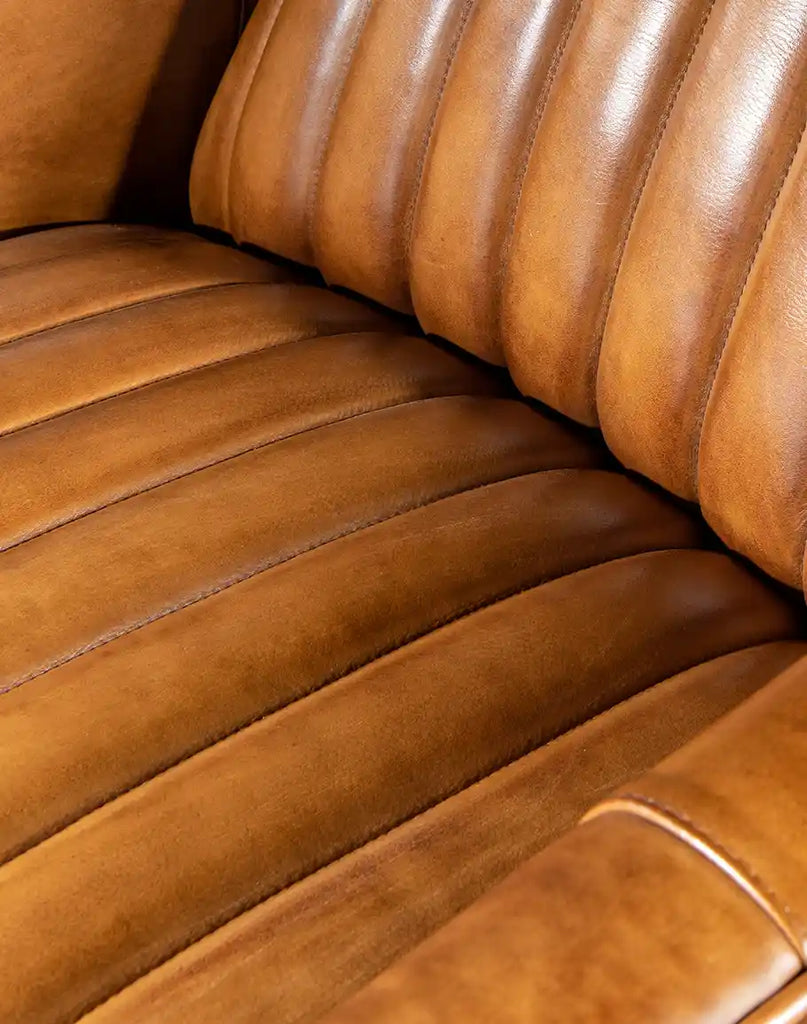 Detailed shot of the hand-stitched channel back and seat cushion, emphasizing the fine craftsmanship of the Ramses Saddle Leather Recliner.