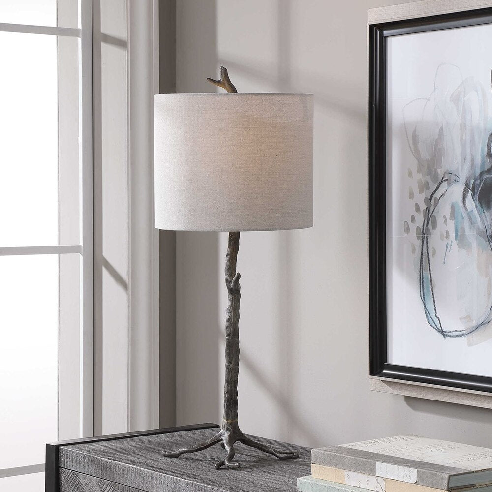 Ramulus Table Lamp with an organic base in gunmetal, gold accents, and a light beige slubbed linen drum shade.