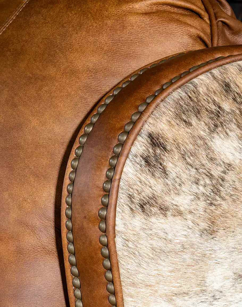 Close-up of the brindle cowhide adorning the sides and back of the Rancher Brindle Recliner.